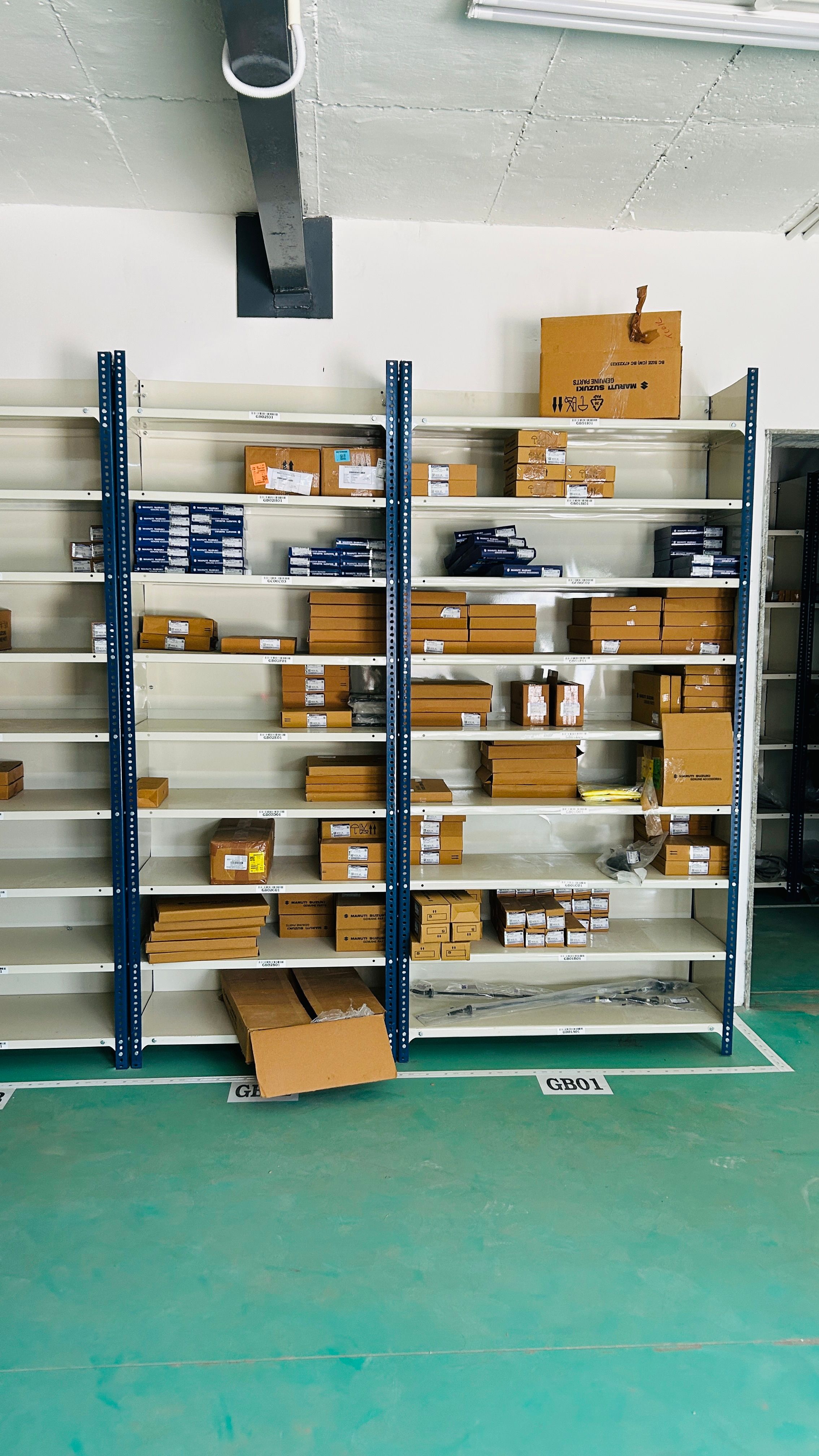 Slotted angle racks manufactured by Amar Steel Industries
